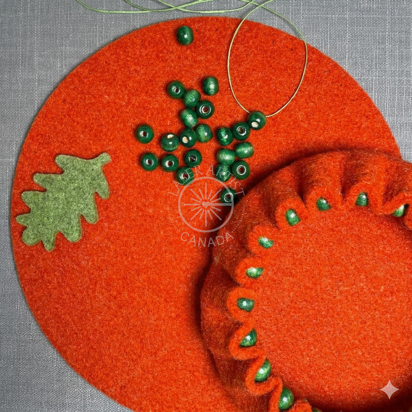 Set of three modern felt bowls with decorative beads for home decor