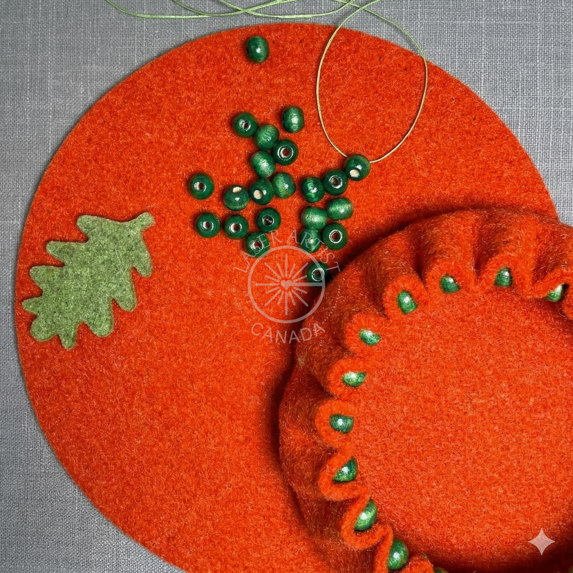 Set of three modern felt bowls with decorative beads for home decor